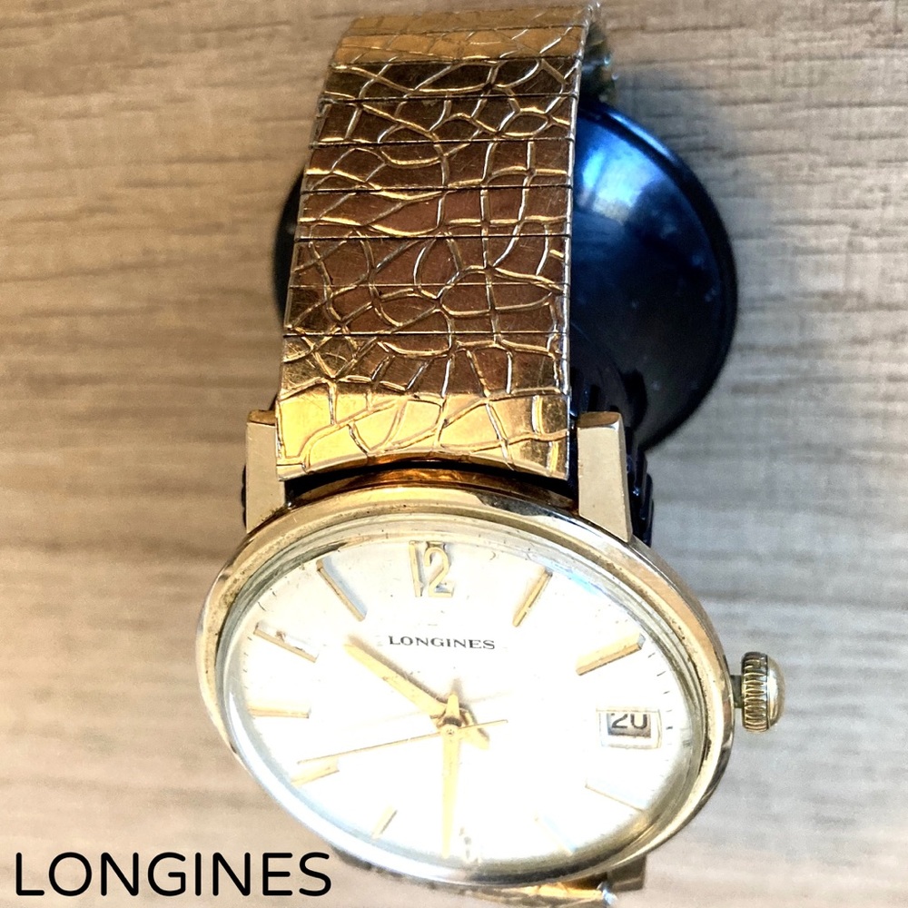 Men’s Longines watch 36mm case size with original metal watch band.